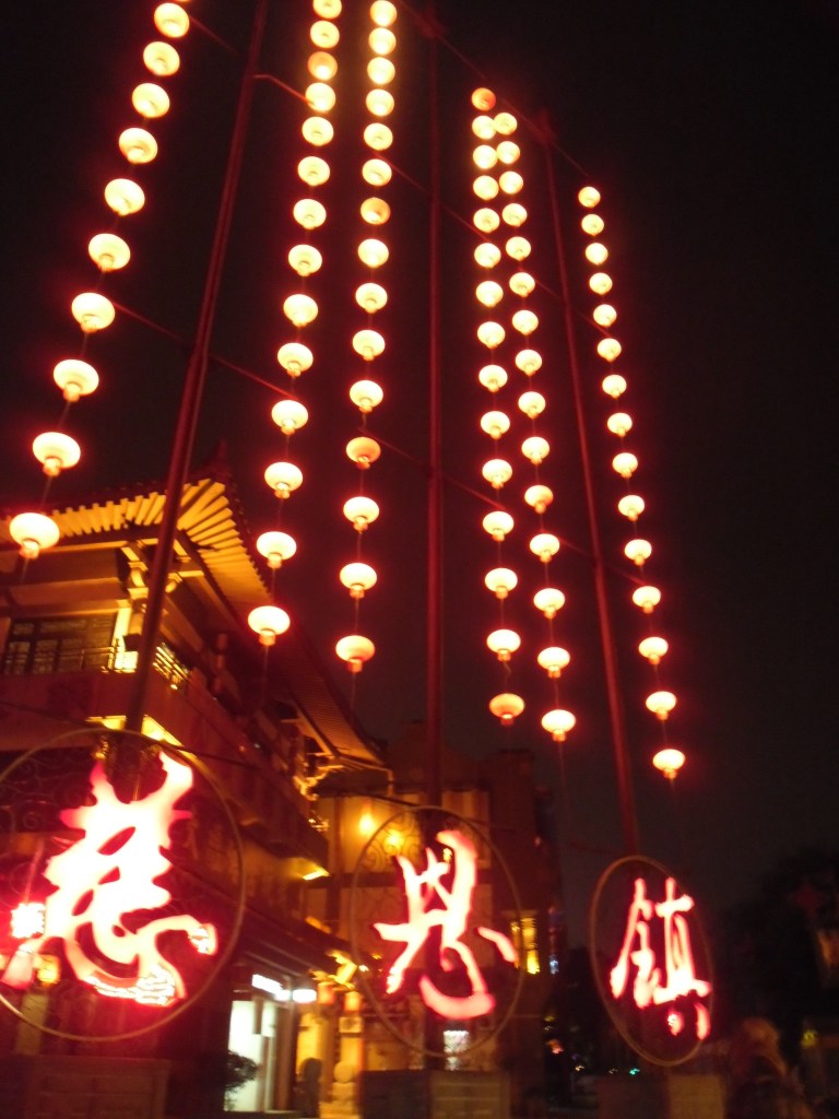 Fiery lanterns are released out into the depths of flaming jet black skies for the lantern festival.